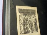 an old book with a picture of a group of people in a room