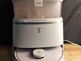 a white blender sitting on top of a wooden table