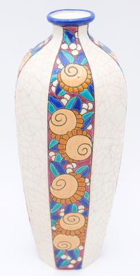 a vase with a colorful design on it on a white surface