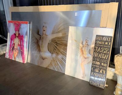 a table with pictures and a picture frame on it