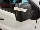 a white car with a sticker on the side mirror