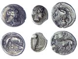 six different types of ancient coins are shown on a white surface