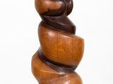 wooden sculpture of a spiral design on a white background