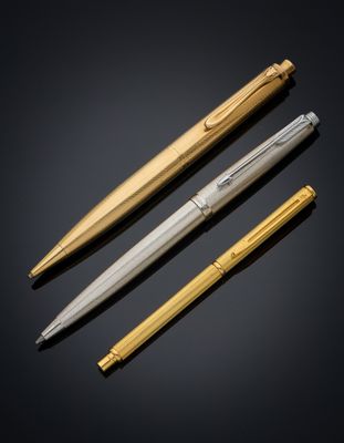 three different types of pens on a black background
