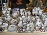a table with many different types of china on it