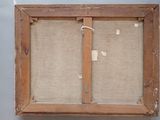 an old wooden frame with a piece of fabric hanging on it