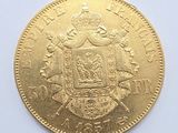 an image of a close up of a gold coin on a white surface