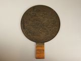 a large bronze medallion hanging on a wall