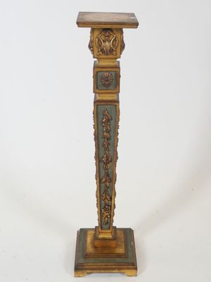 an image of a gold and green pedestal with a clock on it