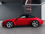 the red sports car is parked in the garage with its roof down