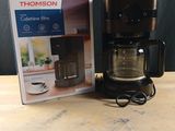 a coffee maker that is sitting on a table