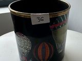 a black bucket with a picture of hot air balloons on it