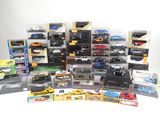 many different types of toy cars and trucks in the box
