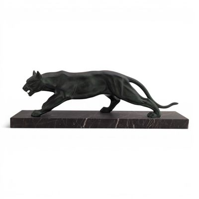 a statue of a black panther on a marble base