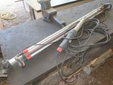 an image of a metal object on a table with wires