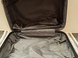 a piece of luggage that is open on the floor