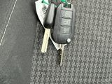 a car key and a pair of keys on the seat