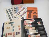 a lot of stamps in a folder on the table