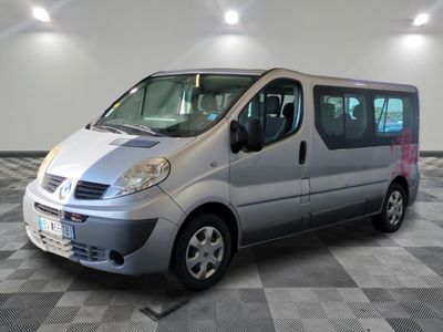 a silver van that is parked on a checkered floor