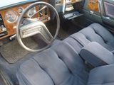 a car dashboard with a steering wheel and a dash board