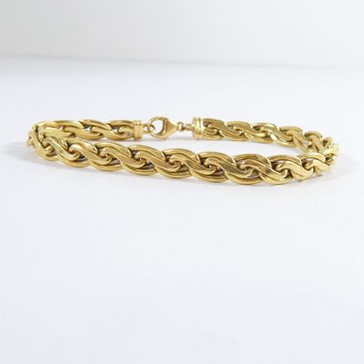 an image of a gold bracelet on a white background