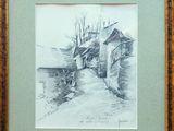 drawing of an old house in a frame on a wall