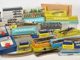 a pile of toy train tracks and other toy trains