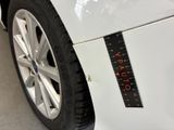 a sticker on the side of a white car that says vat vat vat vat vat vat vat vat vat