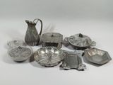 a lot of silver items that are on the table