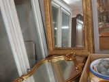 a mirror and a bowl on a table in a room