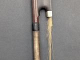 an image of a pair of wooden sticks and a knife on a table