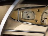 a close up of a car dashboard with a clock on it