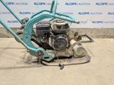 an image of a lawn mower that is being used