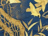 a blue and gold fabric with birds and flowers on it