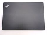 a laptop that is sitting on a white surface
