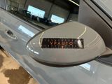 a close up of a car ' s side mirror with a sticker on it
