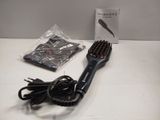 a hair brush and a hair dryer on a table