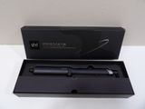 a black box with a black pen inside of it