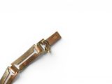 a small metal object that is on a white surface