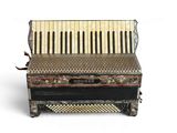 a close up of an old accordion on a white background