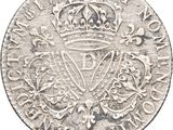 an old silver coin with a crown on top of it