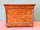 an antique chest of drawers on a pink carpeted floor