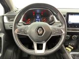 the interior of a car with a steering wheel and dashboard controls