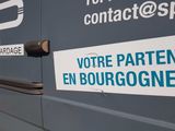 a van that has a sticker on the side of it