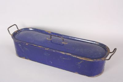 a blue metal container with handles on a white surface