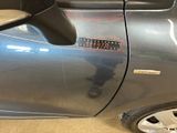 a close up of a car ' s door with a sticker on it