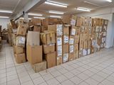 many boxes stacked on top of each other in a room