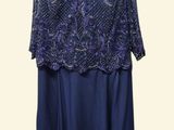 blue dress on a mannequin dummy with a white background