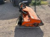 a small orange machine that is sitting on the ground