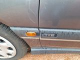 a close up of a car ' s door with the number plate on it